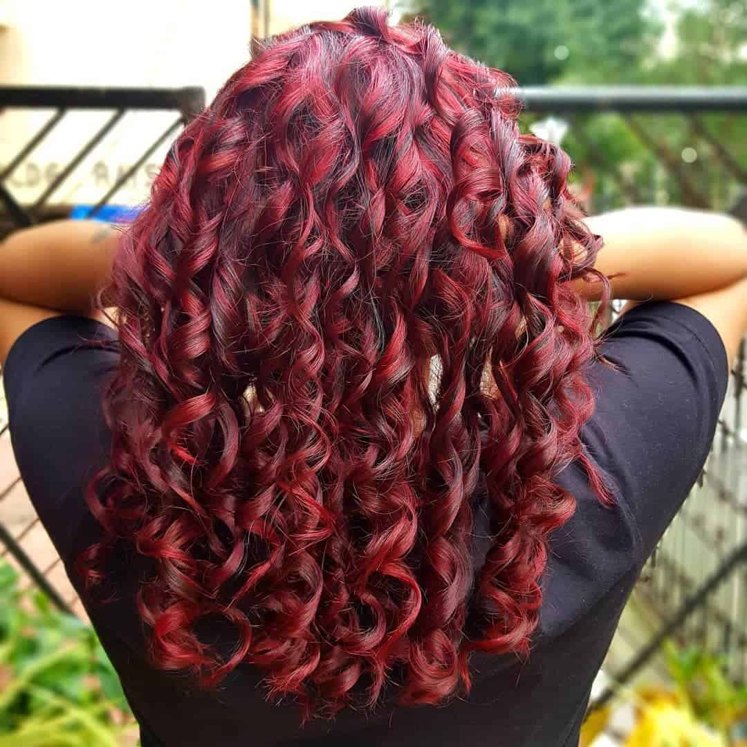 black curly hair with red streaks