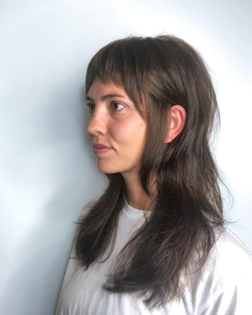 long wolf cut with curtain bangs
